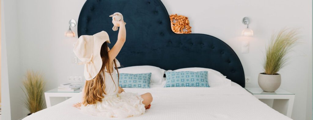 Bedroom with a navy heart shaped headboard